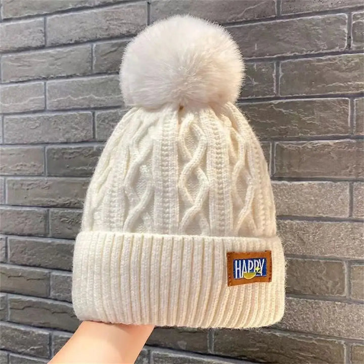 Gorro con pompones chic