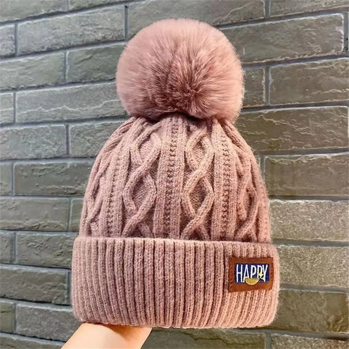 Gorro con pompones chic