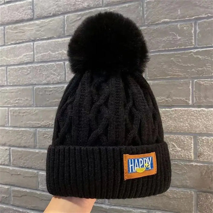 Gorro con pompones chic