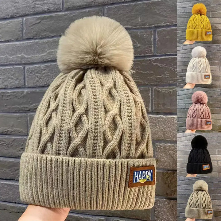 Gorro con pompones chic