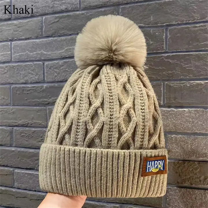 Gorro con pompones chic