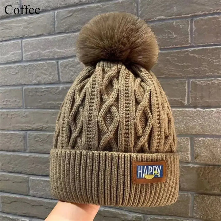 Gorro con pompones chic